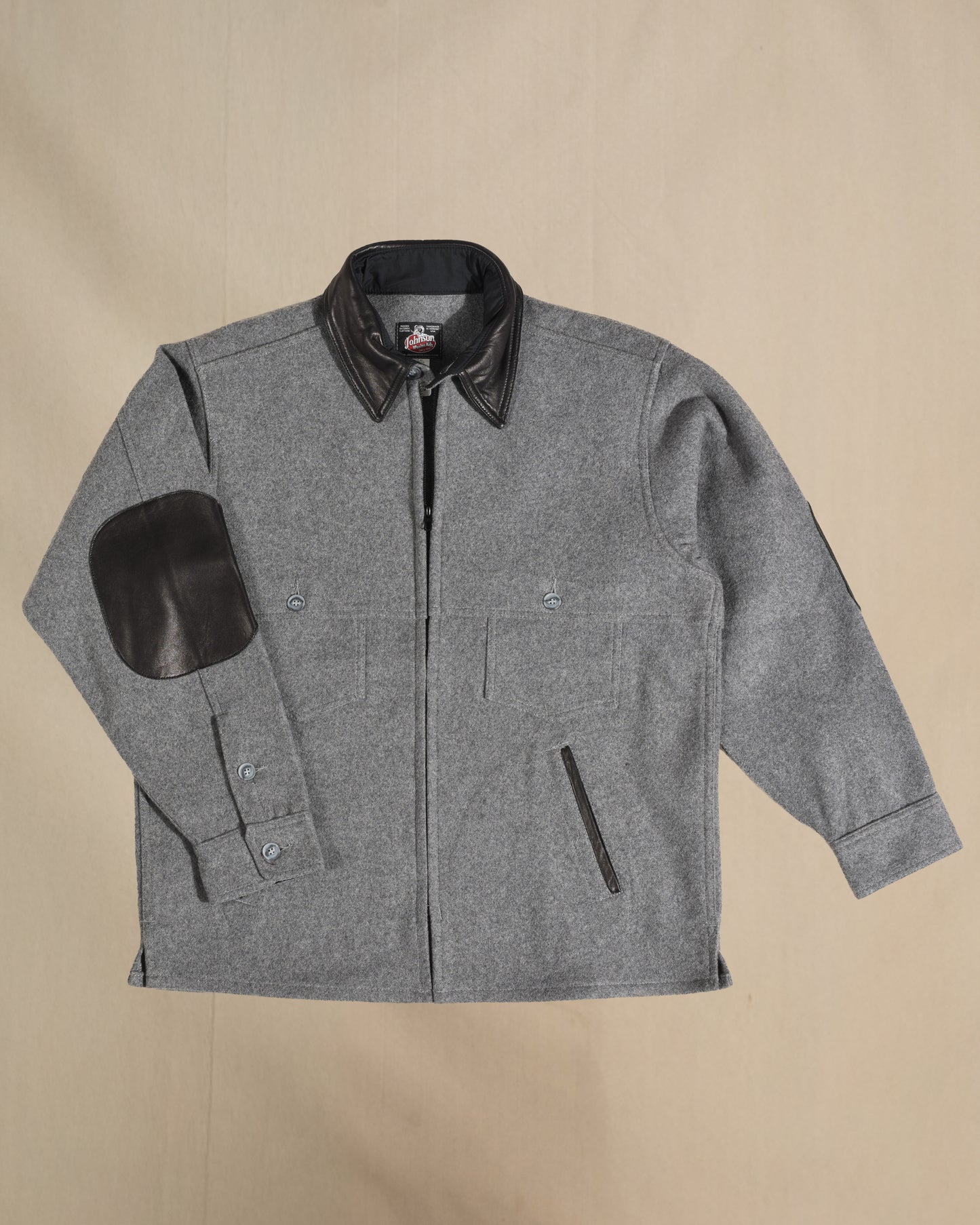 Gray wool jac shirt with leather collar, elbow, and pocket detail.  Front view