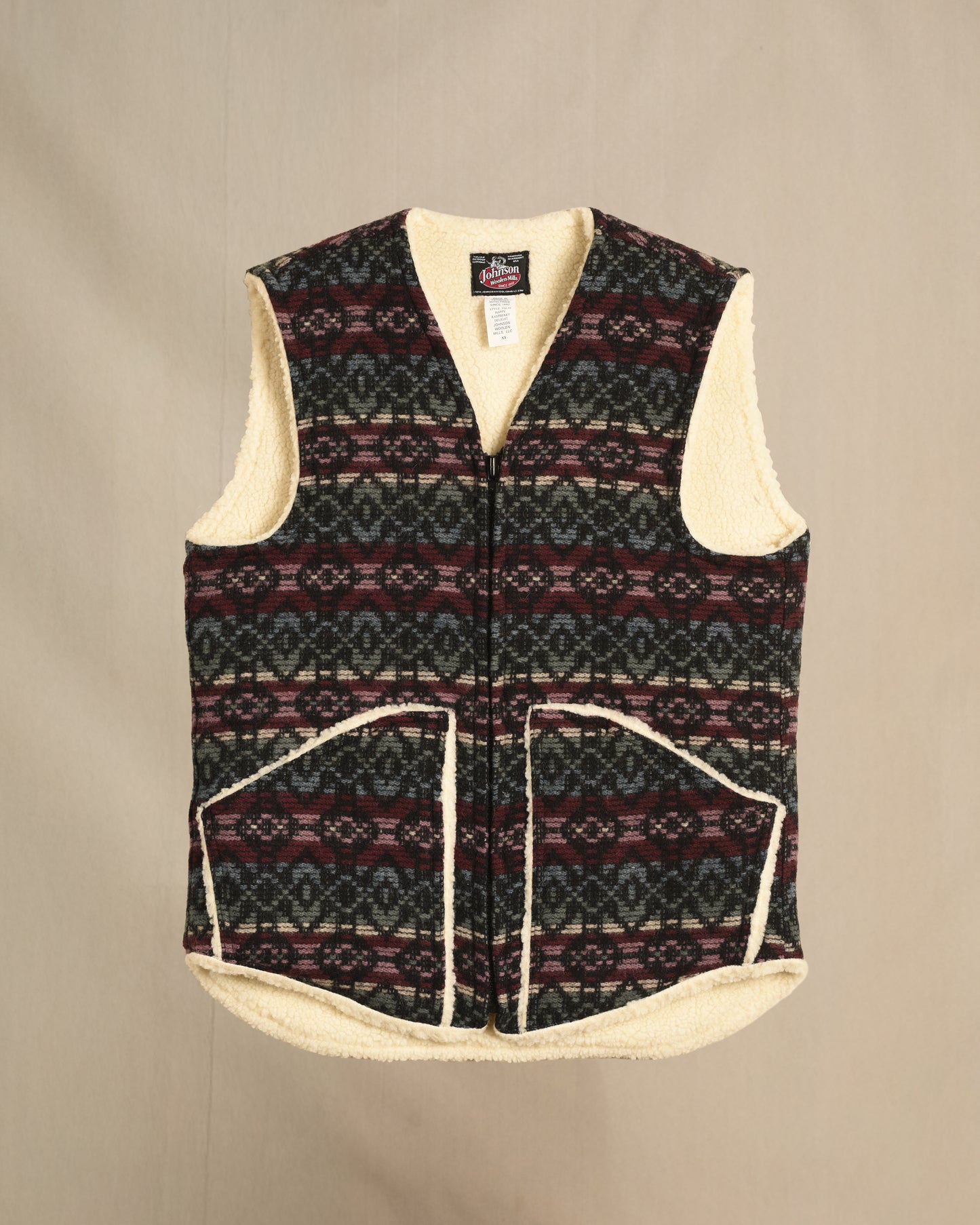 Vest with sherpa lining, raspberry/cream/blue print, zipper front with two pockets, zipped front view