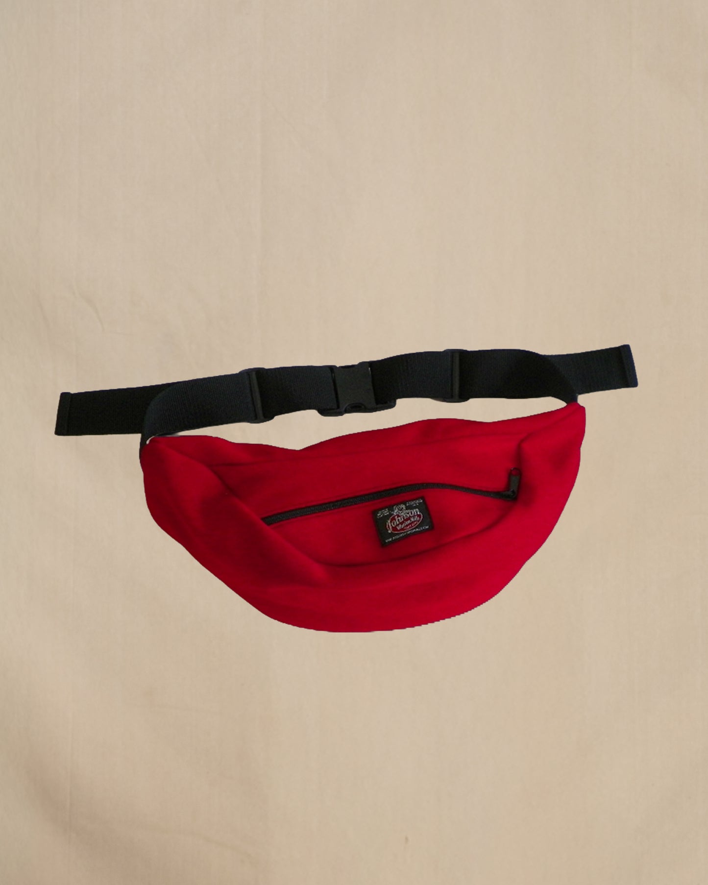 Wool fanny pack with zipper closure and nylon waistband with buckle, shown in scarlett red