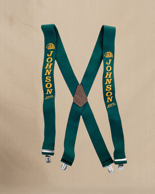 Green suspenders with 'Johnson' branding on a beige background