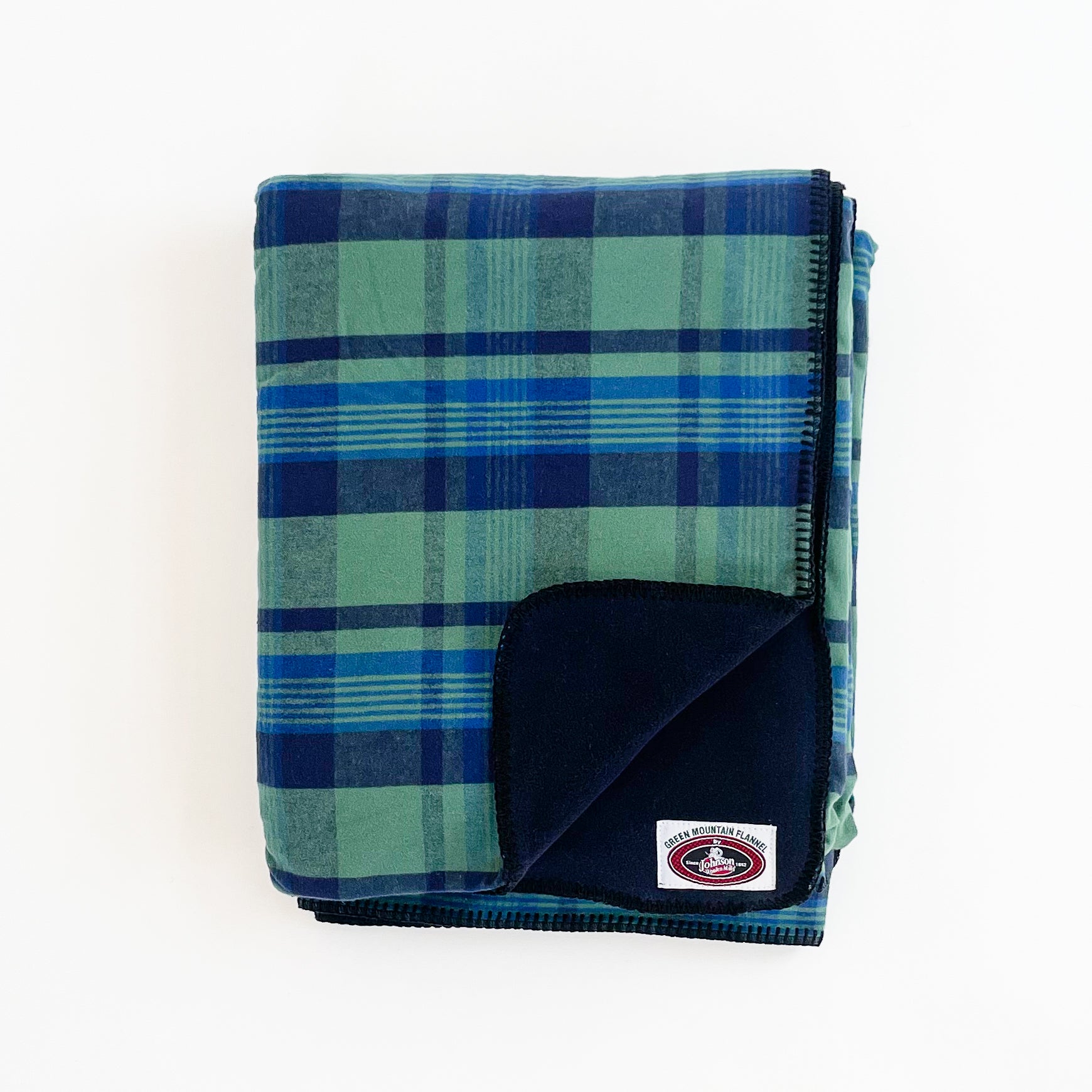 Green Mountain Flannel Throw Royal Navy & Green stripes with black fleece lining open corner view