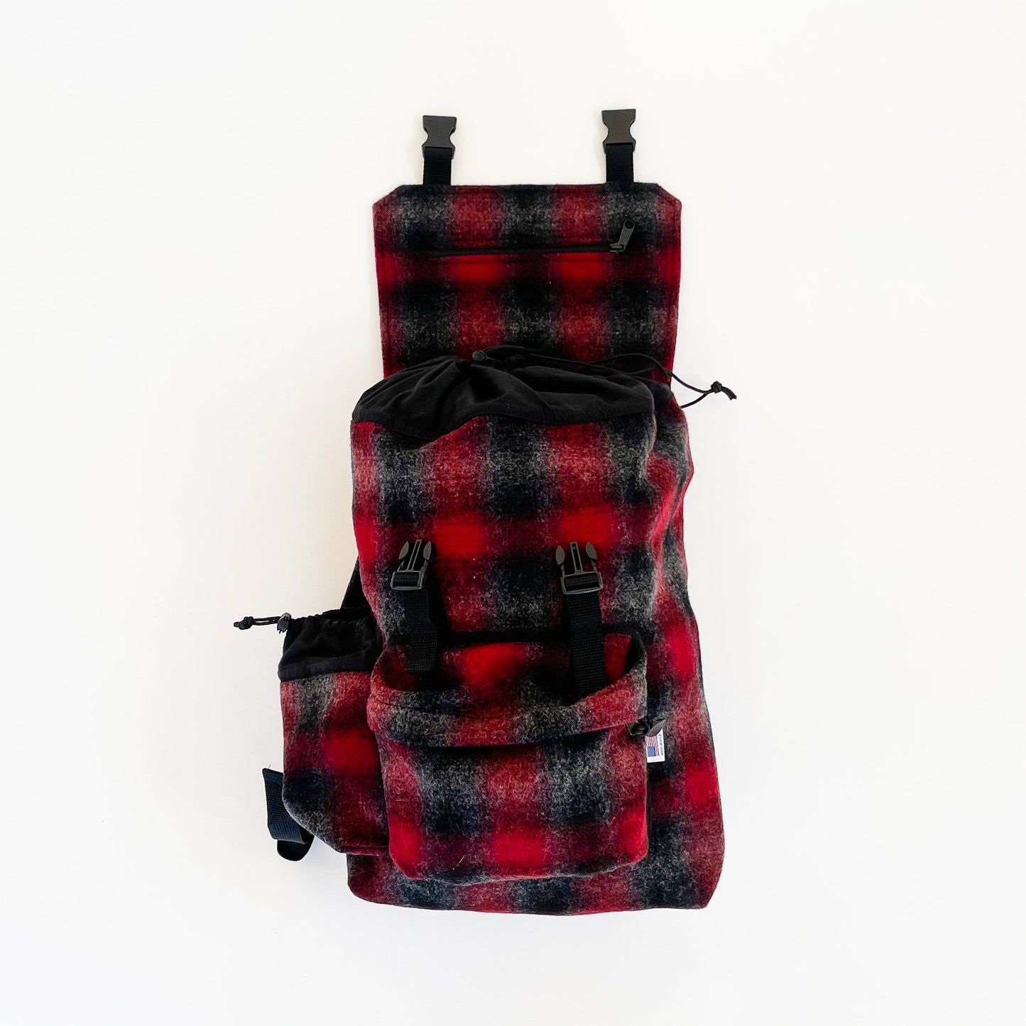 Wool back pack red , black and gray muted plaid with top flap open