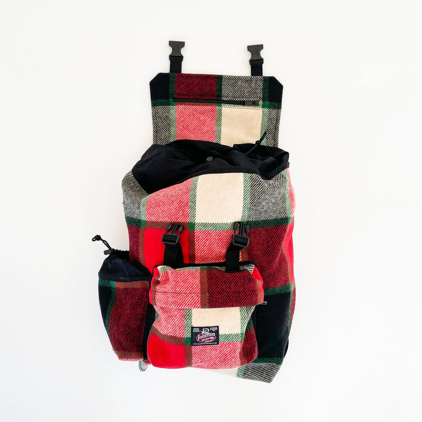 Johnson Woolen Mills Daypack Canadian Plaid Red/Pink/Green/White/ front view  with water bottle in side pocket