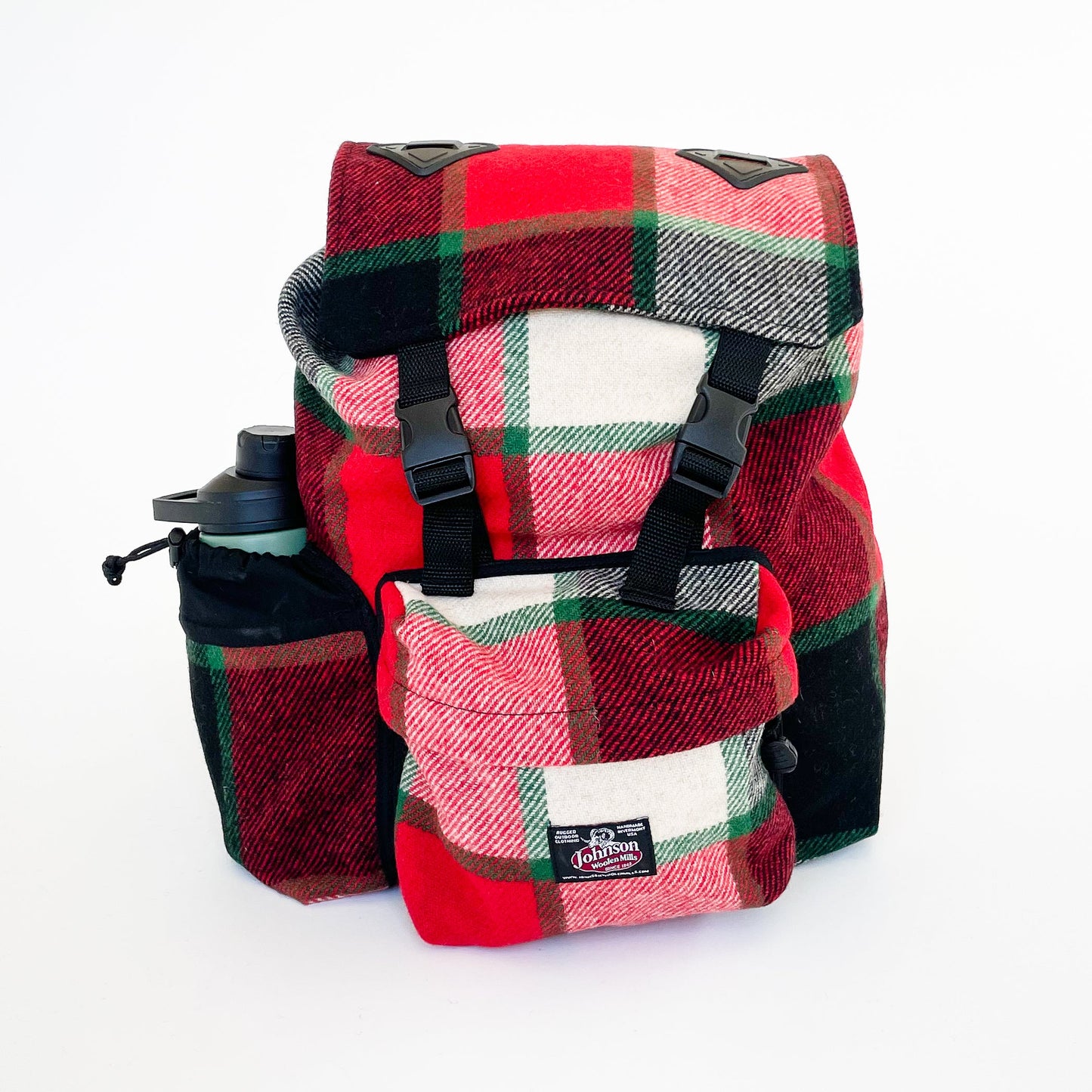Johnson Woolen Mills Daypack Canadian Plaid Red/Pink/Green/White/ front view with water bottle in side pocket