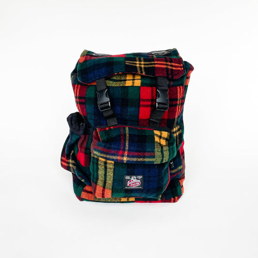 Wool back pack in multi color plaid, front view