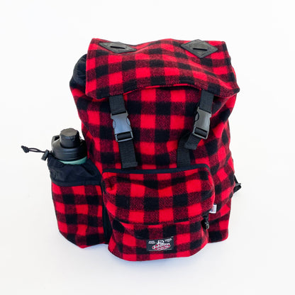 Wool back pack red and black buffalo plaid, shown with water bottle in side pocket