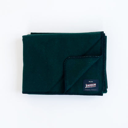Johnson Woolen Mills Spruce Green folded blanket with logo patch front view 