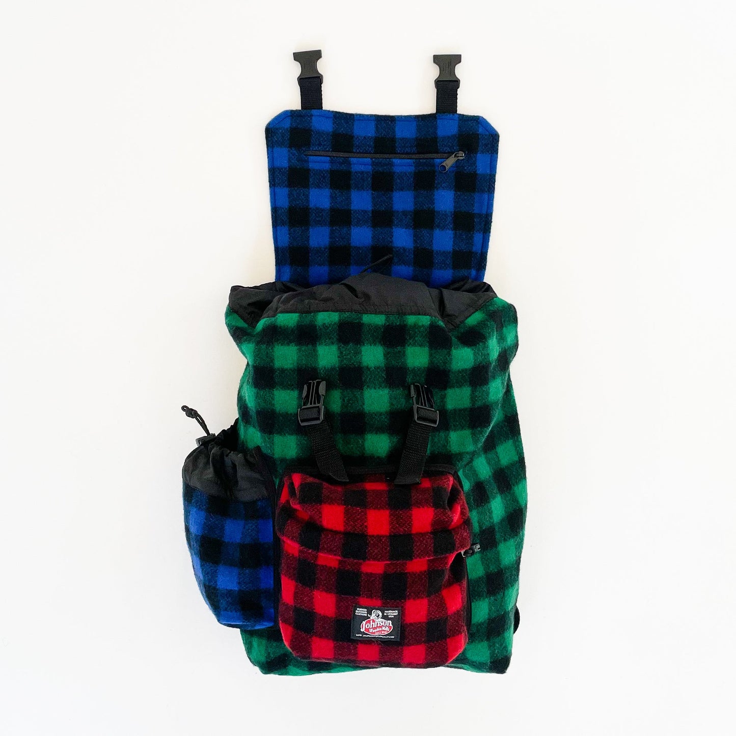Wool back pack in multi color patchwork, with top flap open