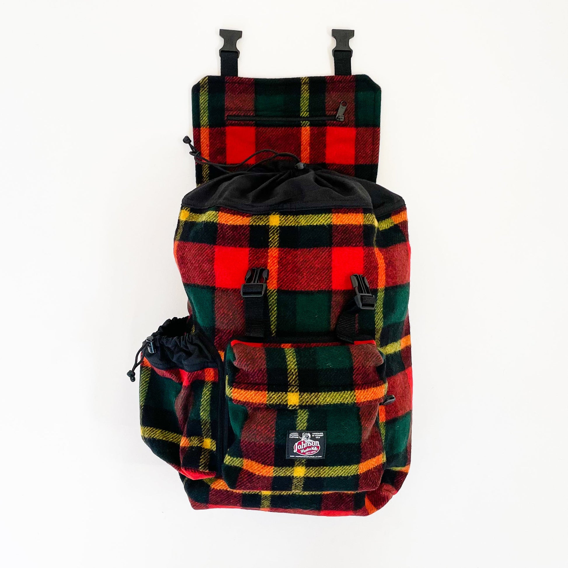Johnson Woolen Mills Daypack Bright Red/Green/Yellow front view with water bottle in side pocket and top flap open