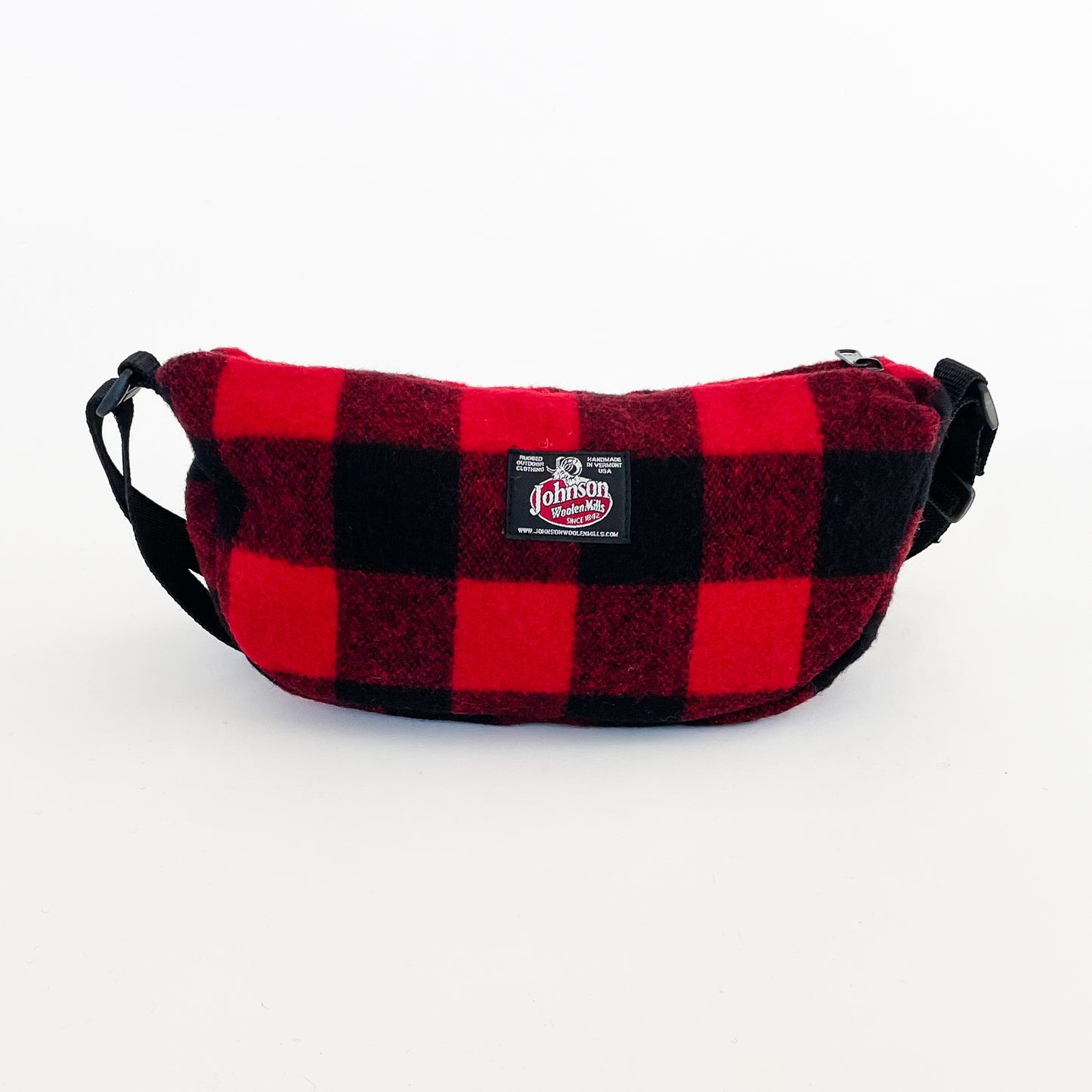 Wool sidewinder bag with strap - bag with zipped closure and belt loops for wearing on your waist plus shoulder strap. Shown in red and black buffalo plaid