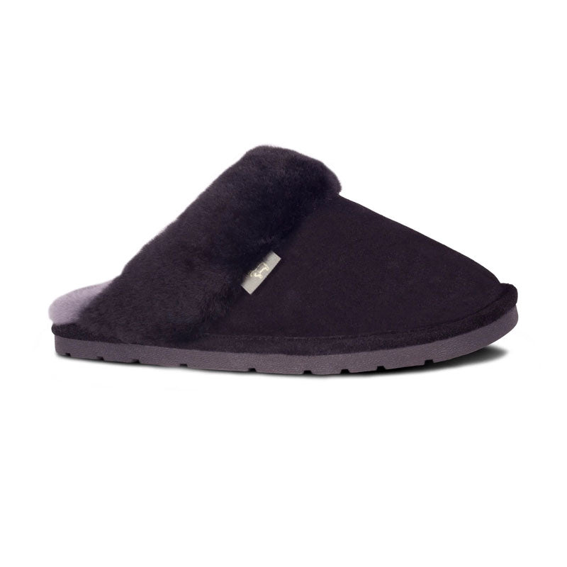 Women's Sheepskin Scuff slip-on Slippers. Black suede leather with white sheepskin lining and rubber sole.  Side view.