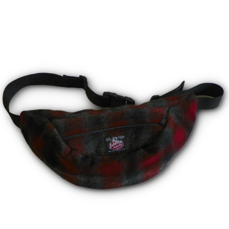 Wool fanny pack with zipper closure and nylon waistband with buckle, shown in red, black and gray muted plaid